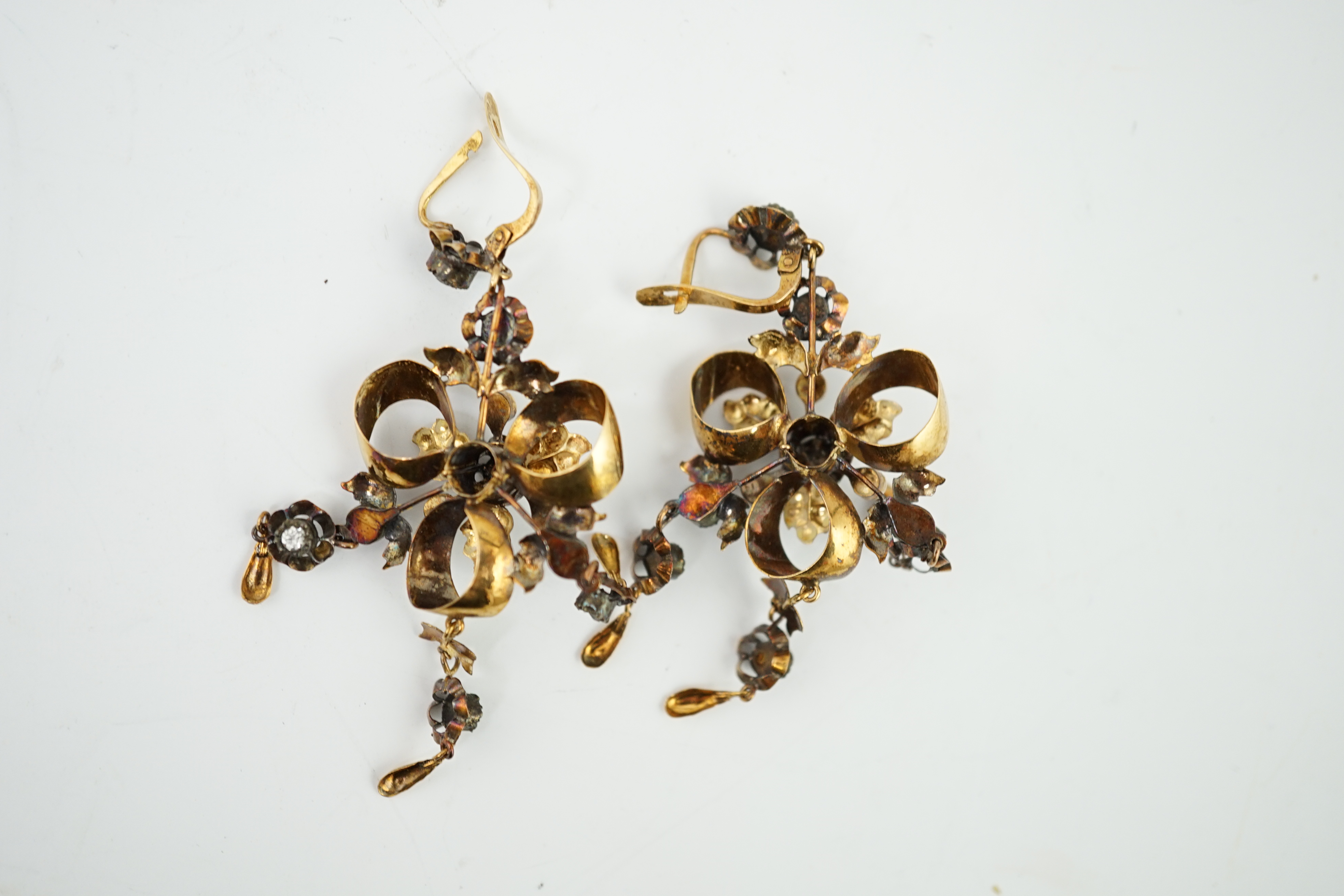 A pair of Victorian gold, seed pearl and simulated diamond set triple drop earrings